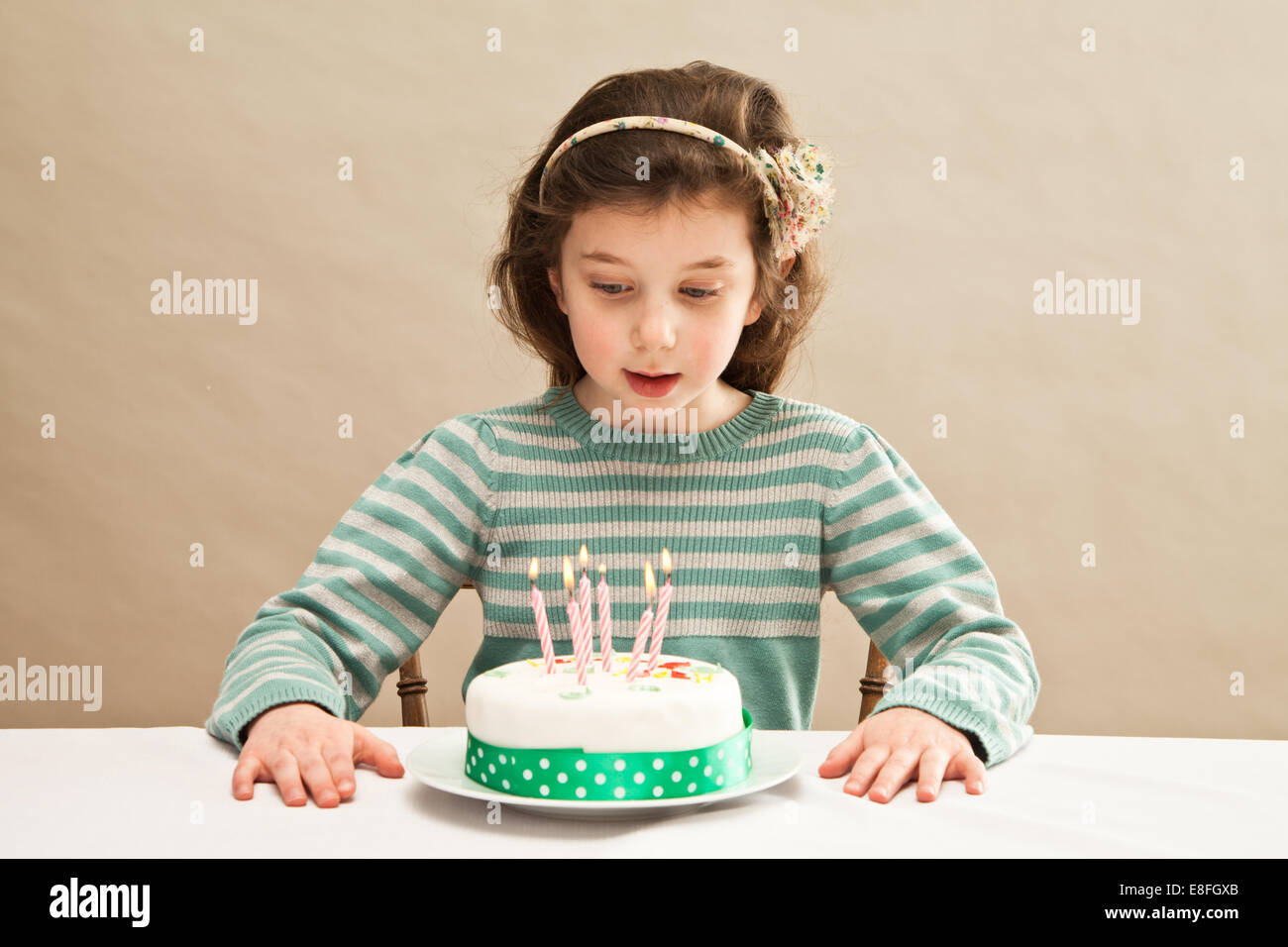 Girl blowing out candles on hires stock photography and images Alamy