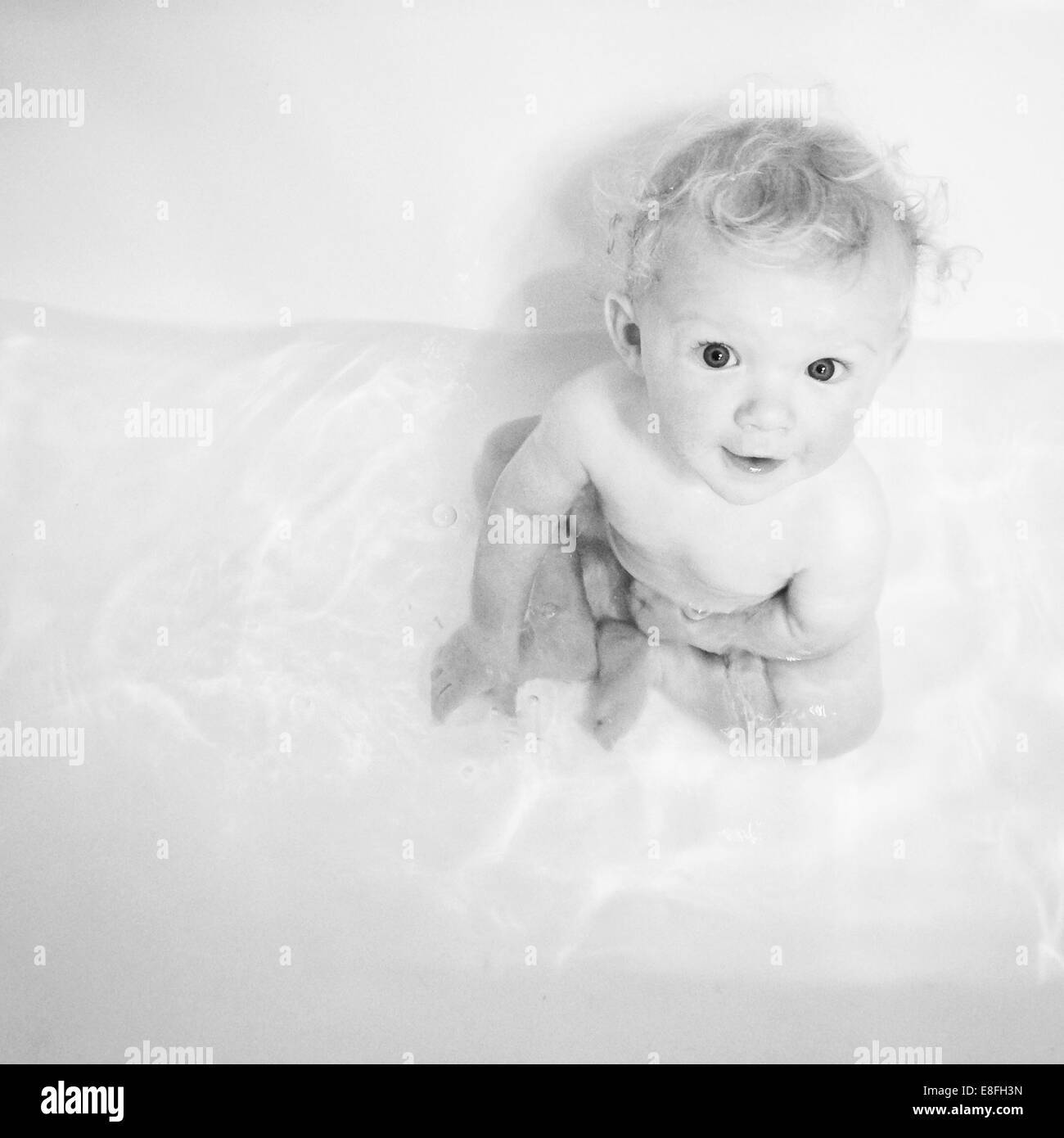 Portrait of boy sitting in the bath Stock Photo