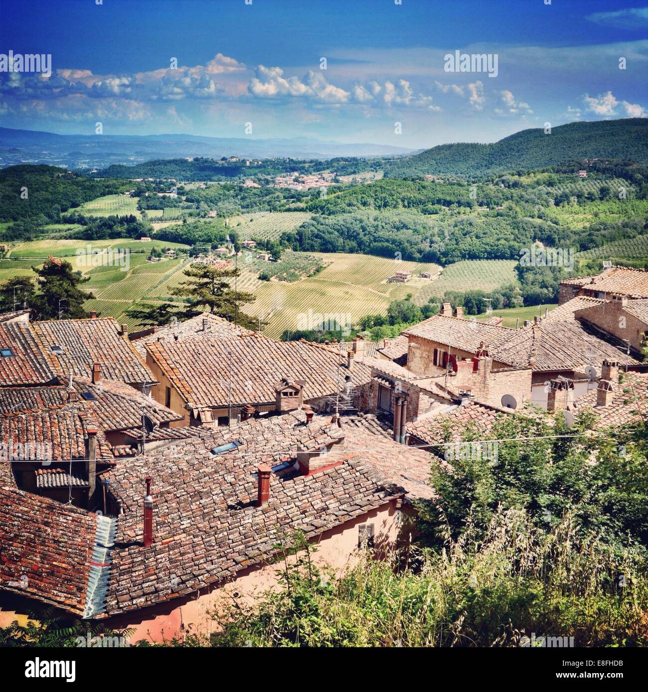 Village rooftops and rural countryside, Tuscany, Italy Stock Photo