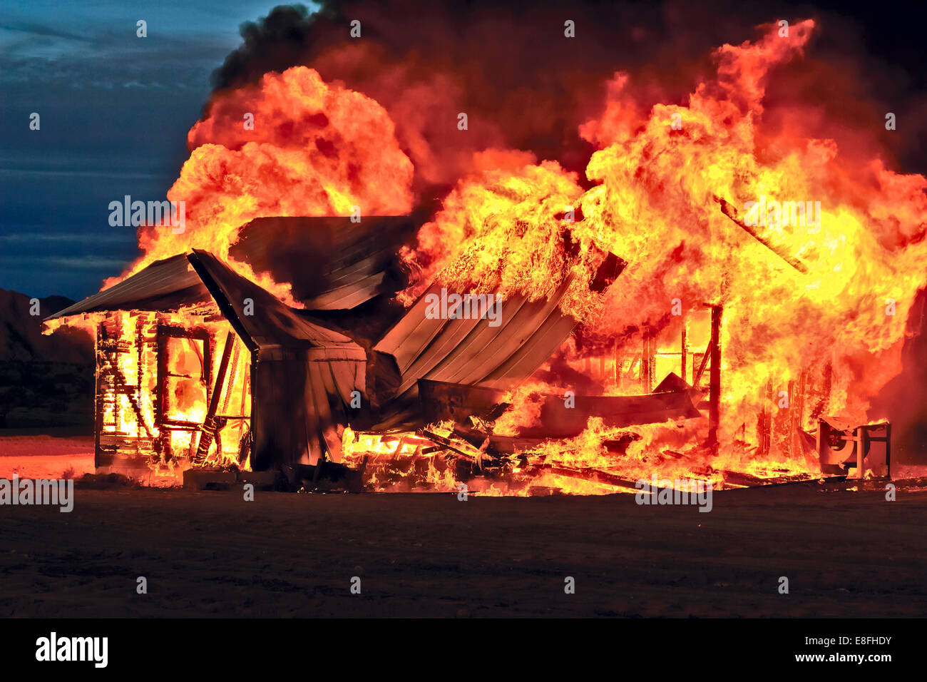 Abandoned house on fire, Gila Bend, Arizona, USA Stock Photo