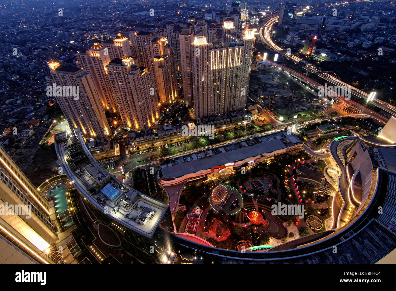 Indonesia, Jakarta Special Capital Region, Daerah Khusus Ibukota Jakarta, Letjen S Parman, Night cityscape seen from Alaina Tower (Central Park) Stock Photo