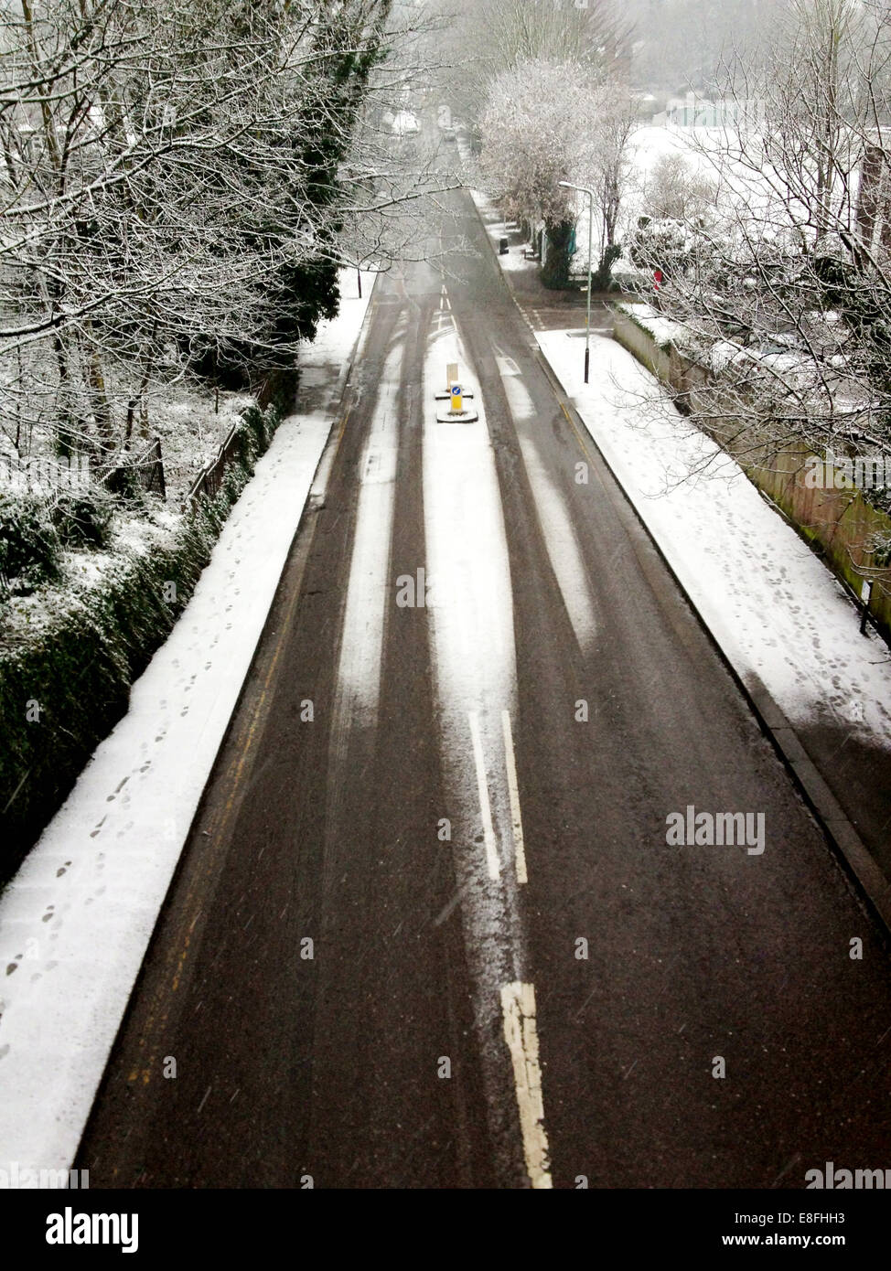 Road covered in snow, Crouch End, London, England, UK Stock Photo