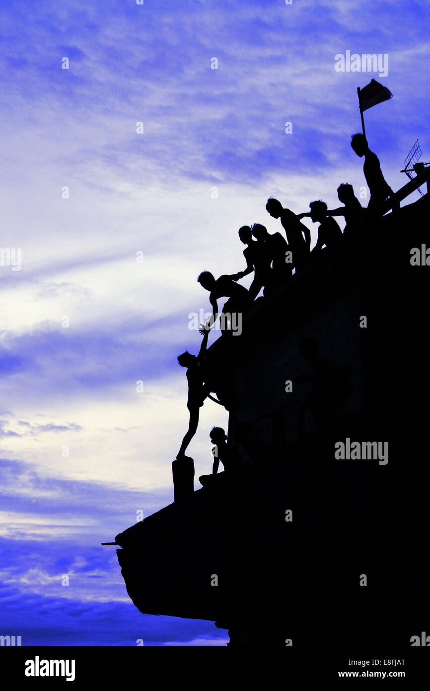 Indonesia, Jakarta Special Capital Region, Penjaringan, Maritim Raya, Teamwork in climbing up Sunda Kelapa Stock Photo