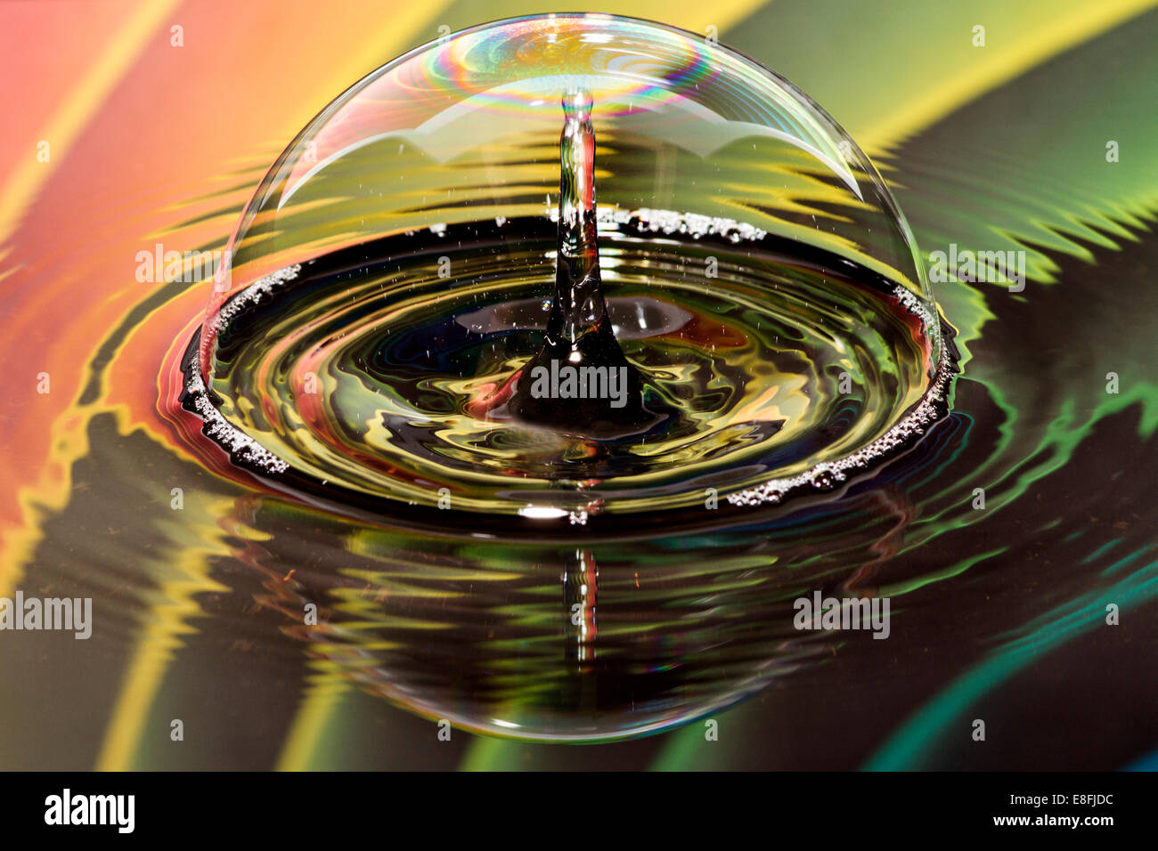 Water drops on bubble with rainbow background Stock Photo