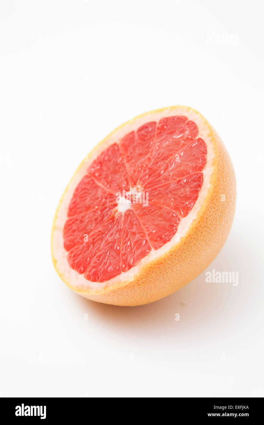 Close-up of half a Grapefruit on a table Stock Photo