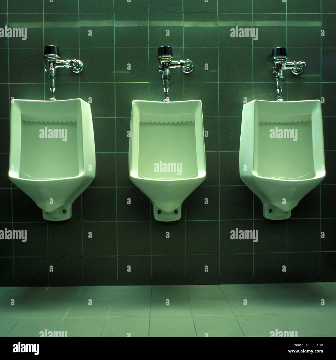 Three Urinals in public restroom Stock Photo 74102907 Alamy
