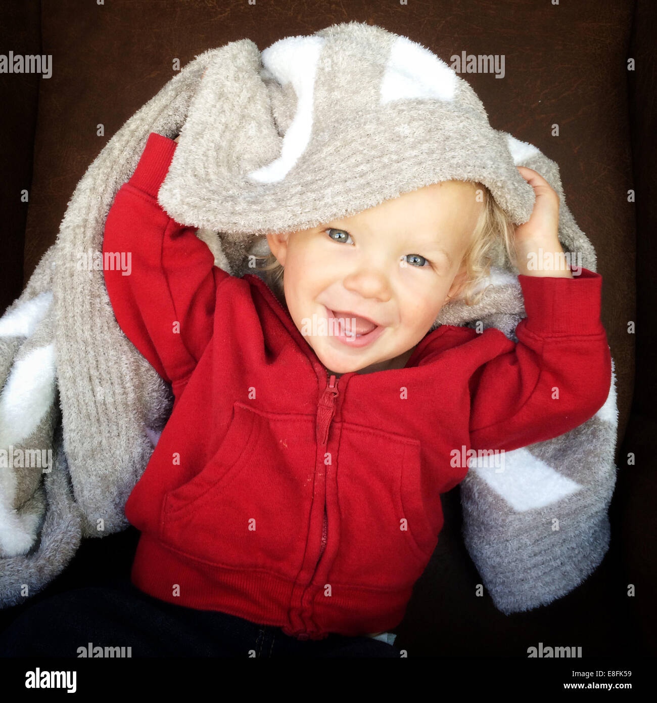 Portrait of a happy boy with a blanket on his head Stock Photo Alamy