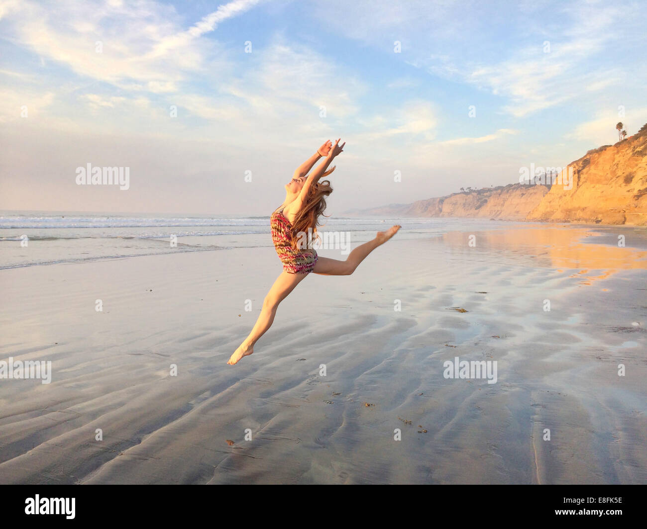 Teenage Girl on the beach dancing, San Diego, California, USA Stock Photo