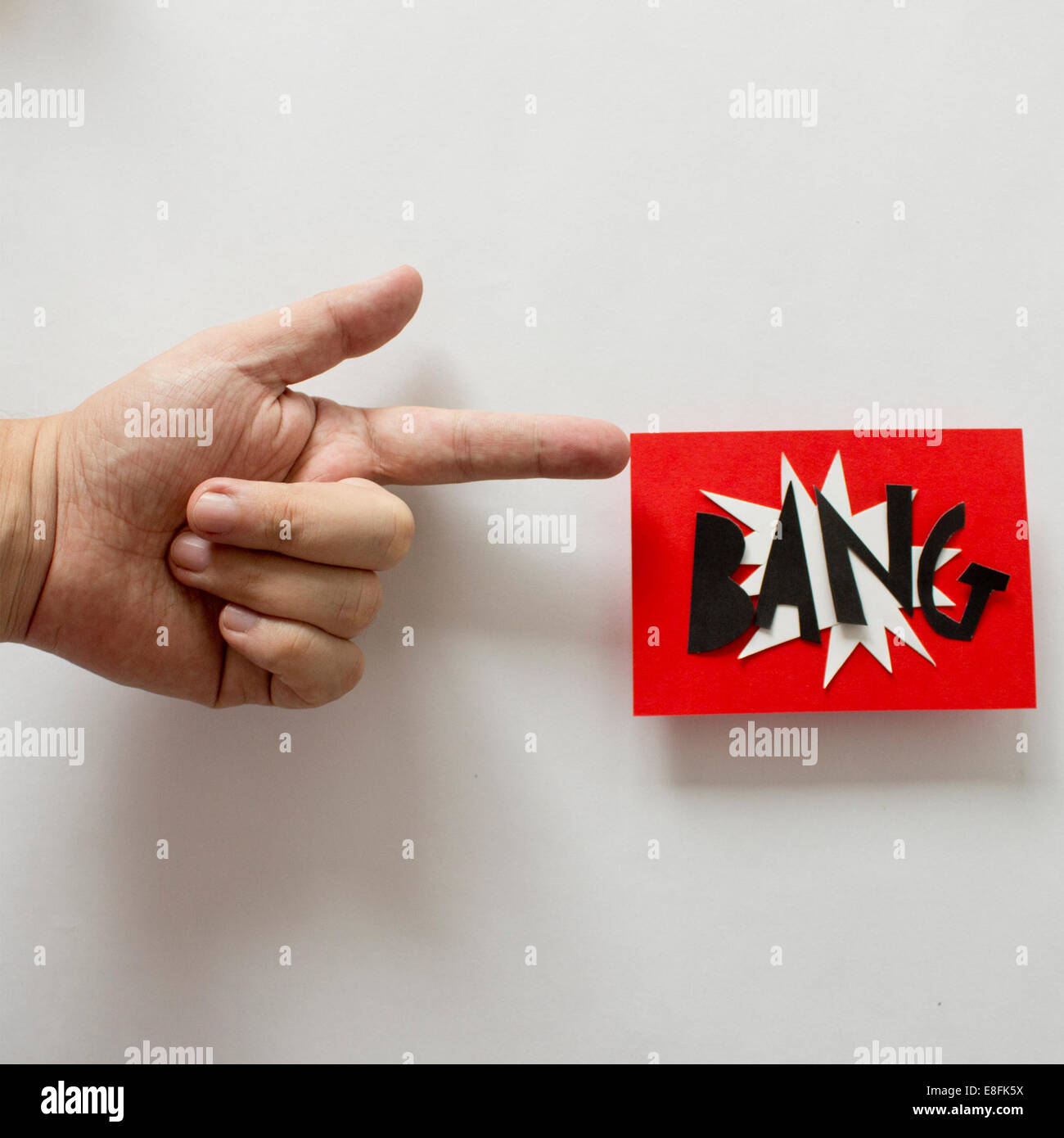 Conceptual toy Gun firing a BANG flag Stock Photo - Alamy