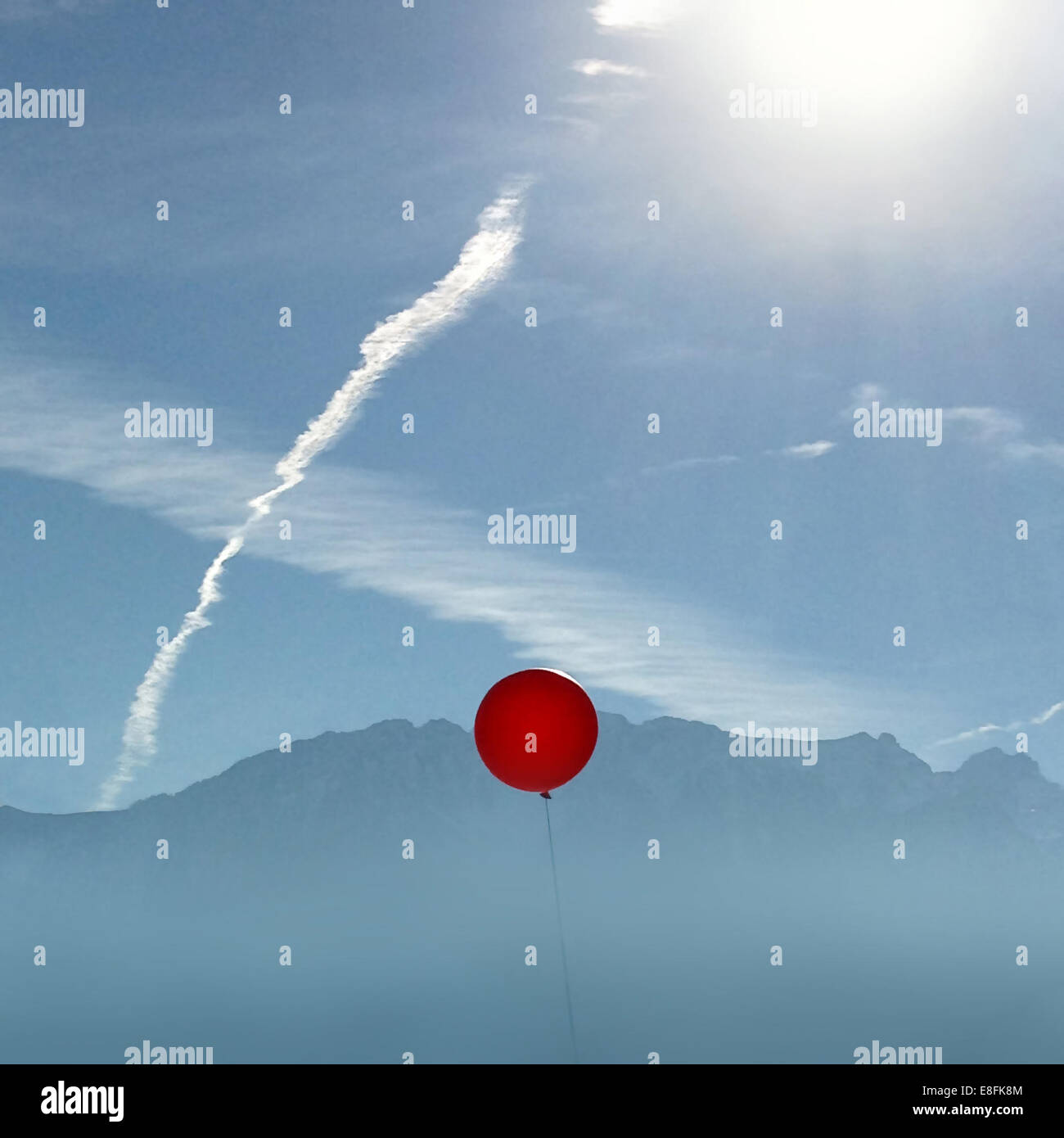 Switzerland, Vaud, Red balloon in the sky Stock Photo
