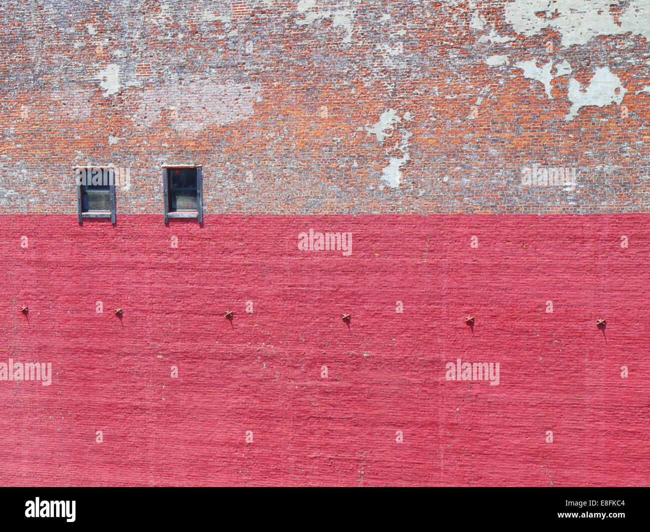 Brick wall with peeling paint Stock Photo