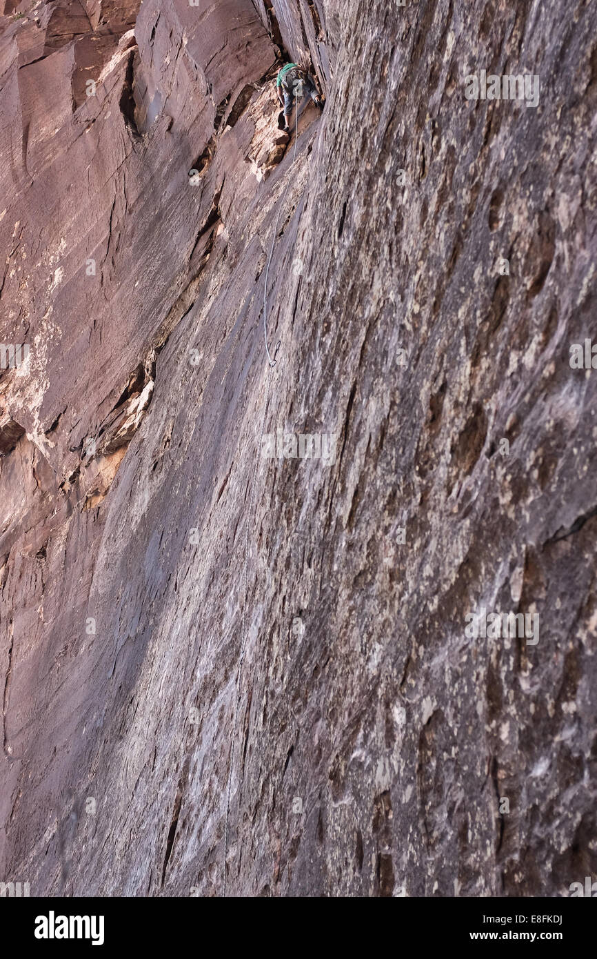 USA, Nevada, Man climbing at Red Rocks State Park Stock Photo