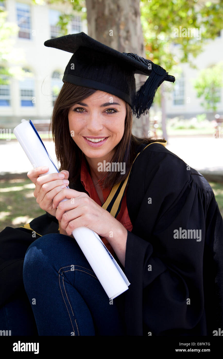Female graduate holding diploma Stock Photo - Alamy