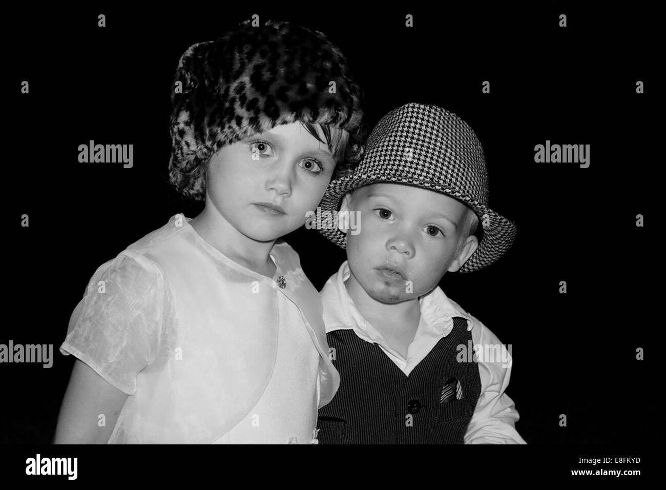 Boy and girl dressed up as an adult couple Stock Photo