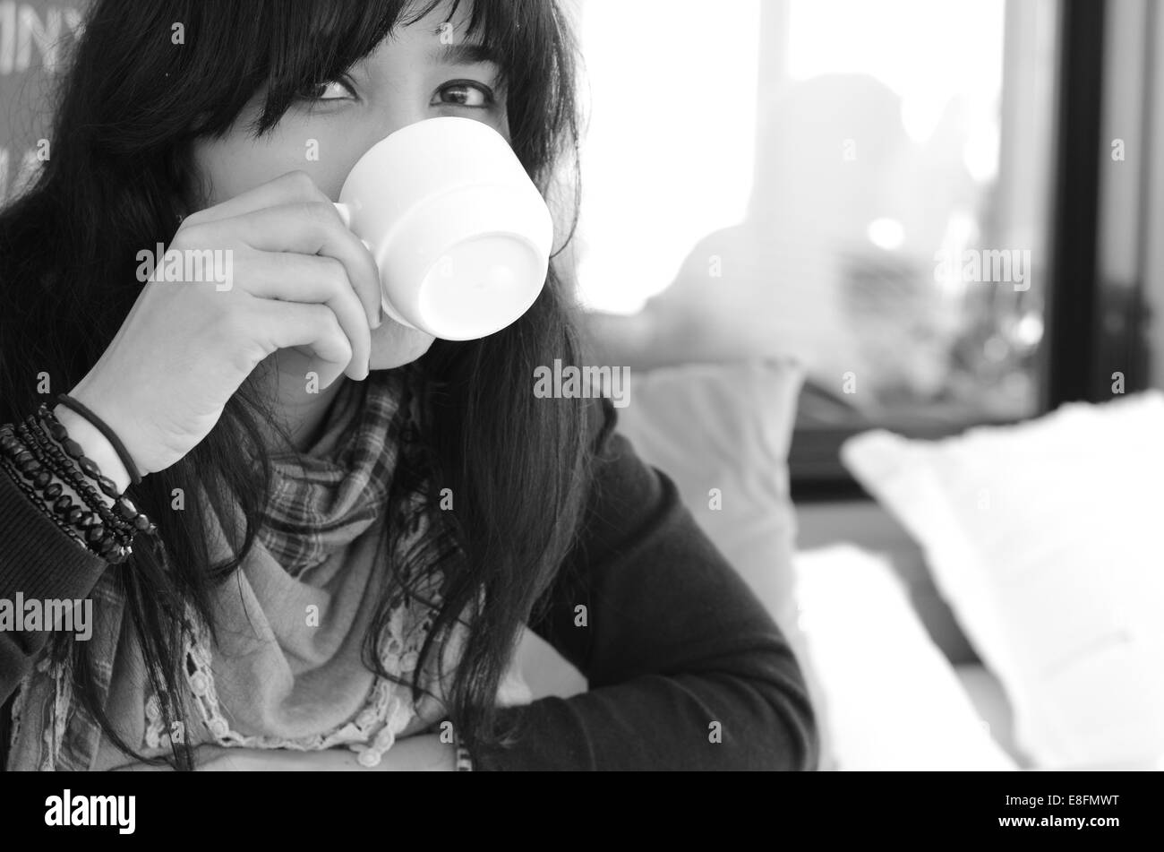 Portrait of woman drinking coffee Stock Photo