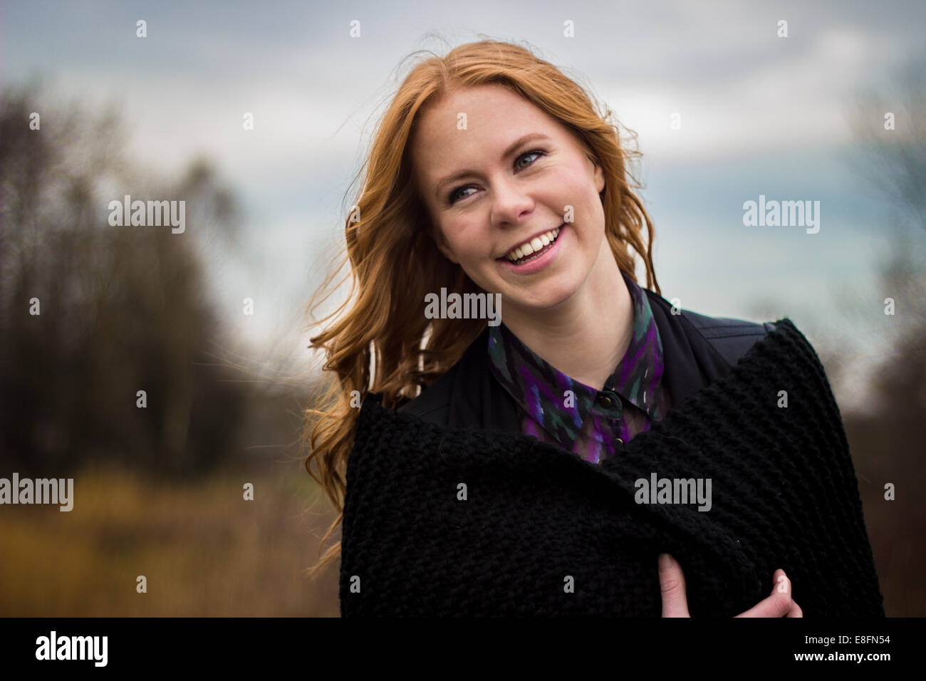 Portrait of a smiling woman outdoors Stock Photo - Alamy