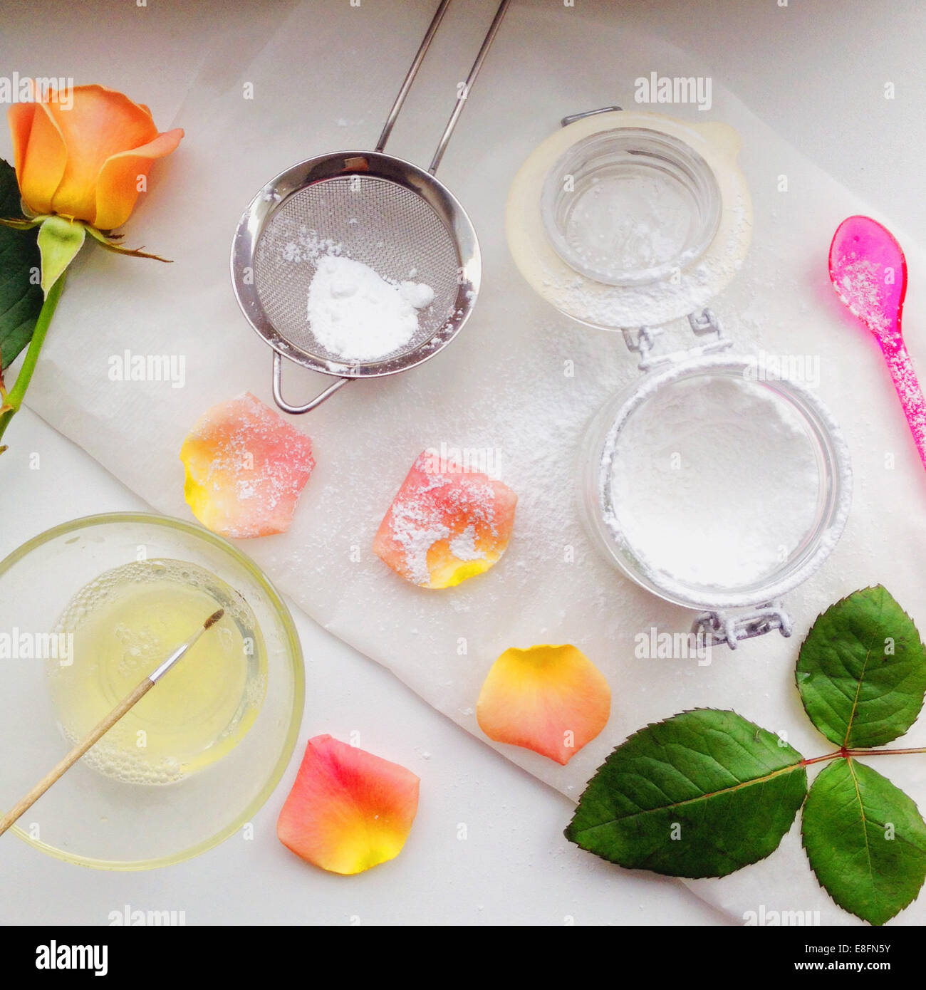 Edible flowers and icing sugar Stock Photo Alamy