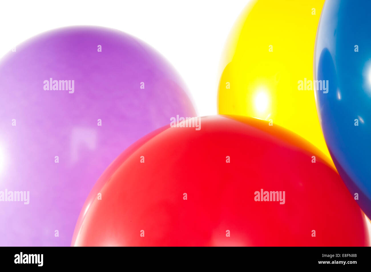 Close up of four helium filled balloons Stock Photo Alamy