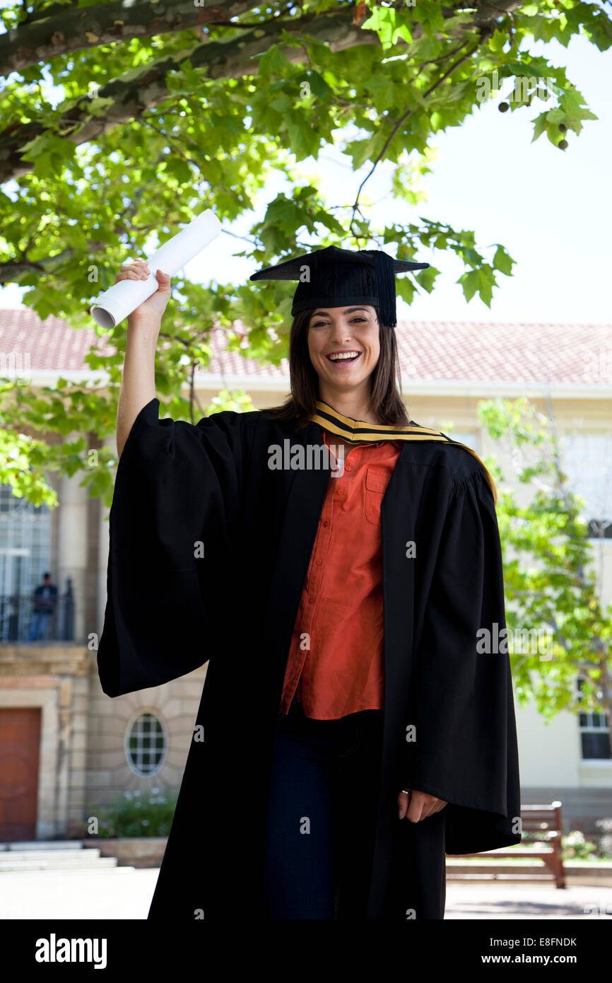 Young graduate holding diploma Stock Photo - Alamy