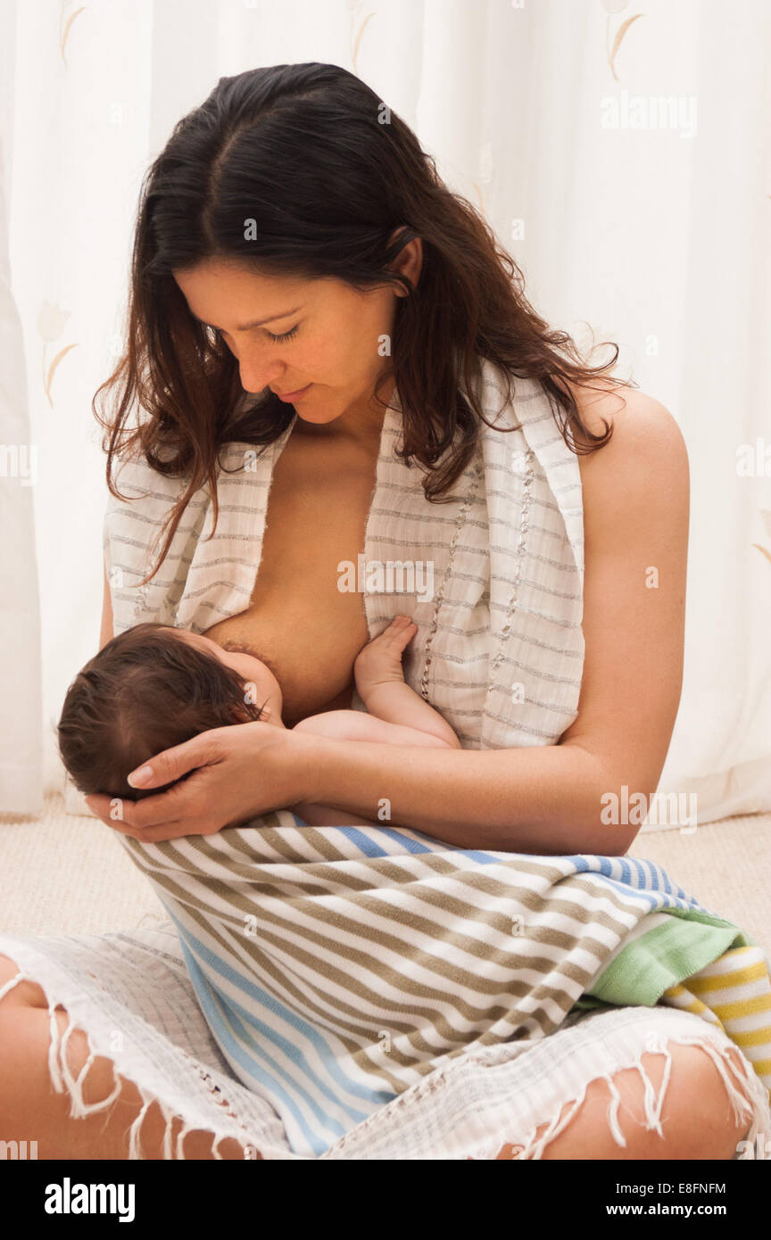 Girl direct on her breast. Stock Photo by ©Anetlanda 122475358