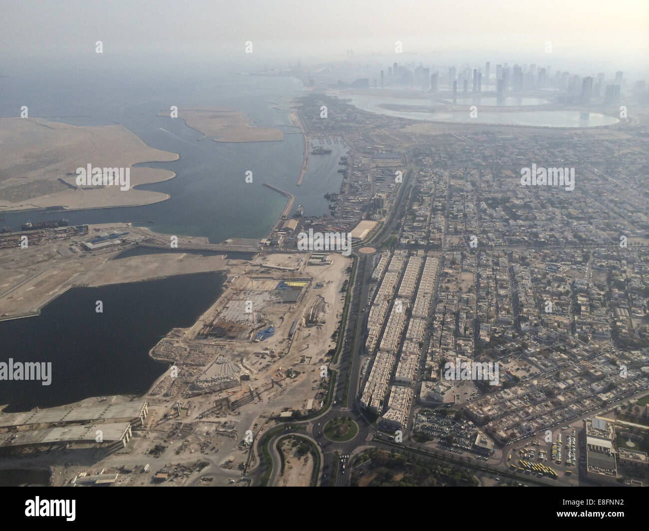 United Arab Emirates, Dubai, Aerial view of construction site and skyscrapers in background Stock Photo