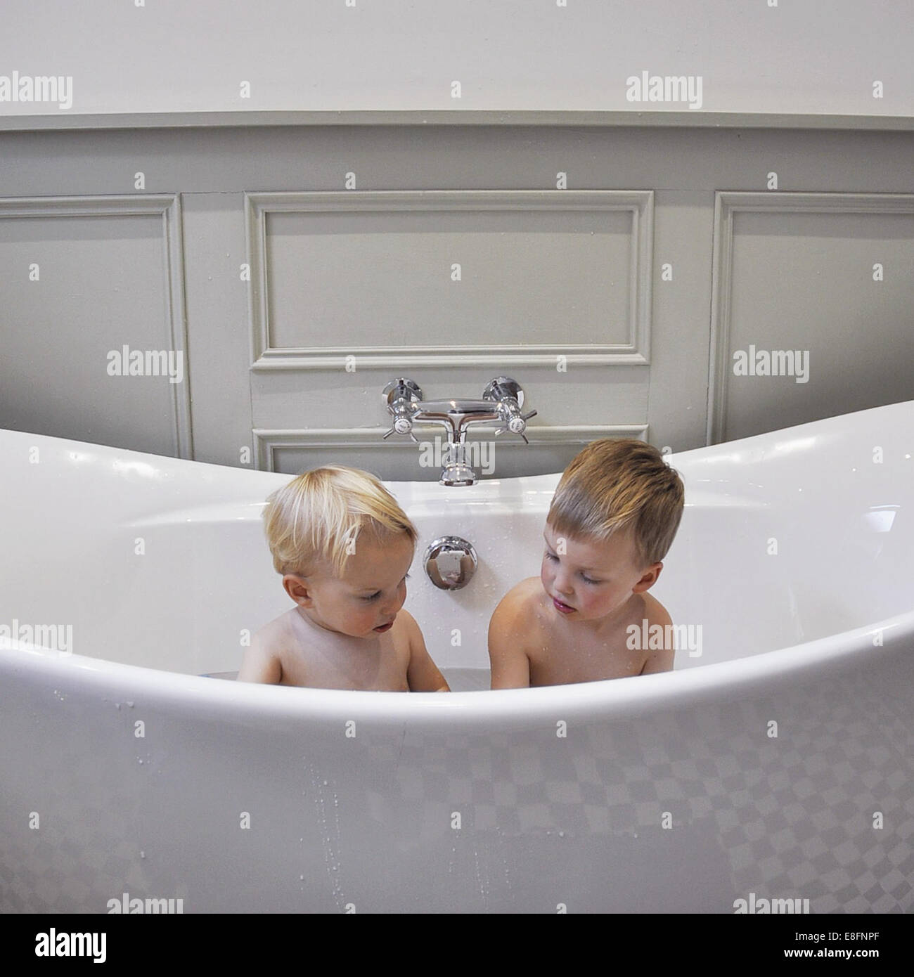Two boys in bathtub Stock Photo Alamy