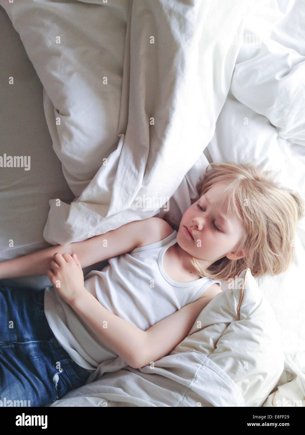 Overhead view of boy sleeping in bed Stock Photo Alamy