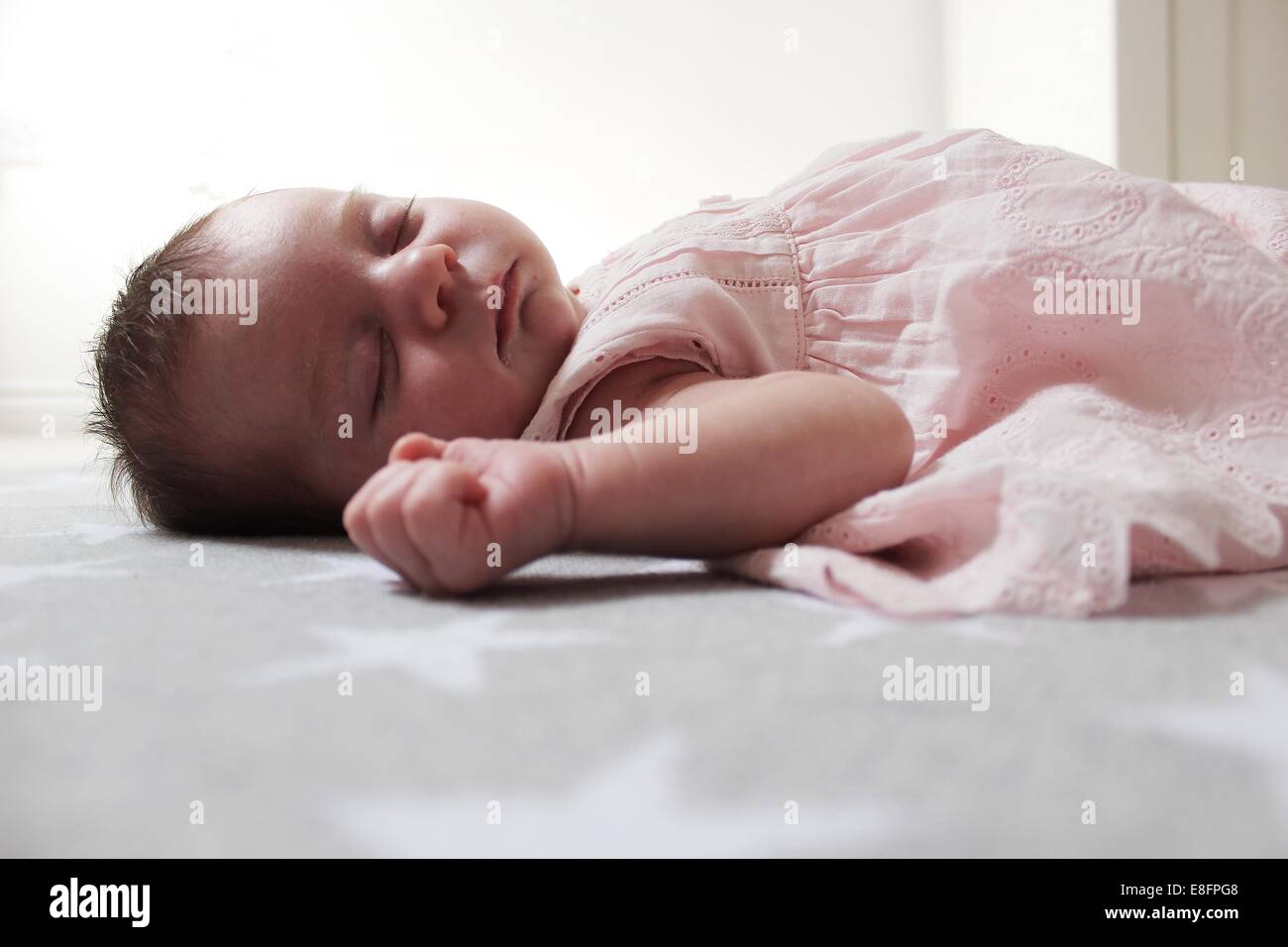 Baby girl lying on blanket sleeping Stock Photo Alamy