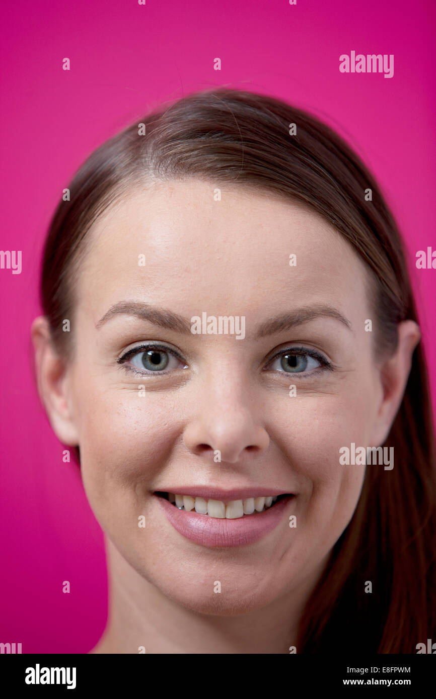 Close-up portrait of a smiling woman Stock Photo - Alamy