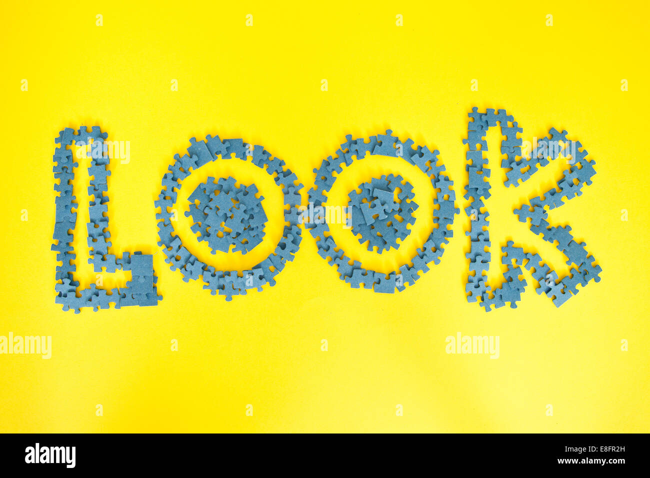 The word look spelled out in jigsaw puzzle pieces Stock Photo