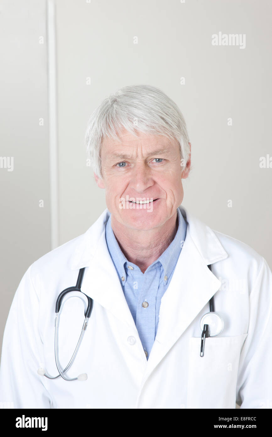 Portrait of doctor smiling Stock Photo - Alamy