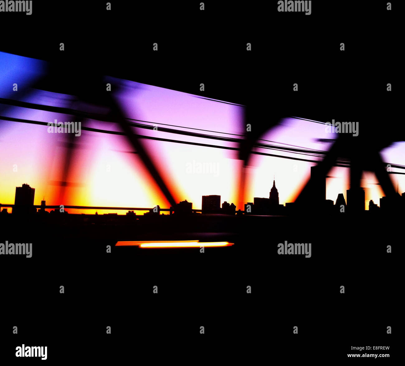 USA, New York City, Manhattan, Colored bridge and city skyline Stock Photo