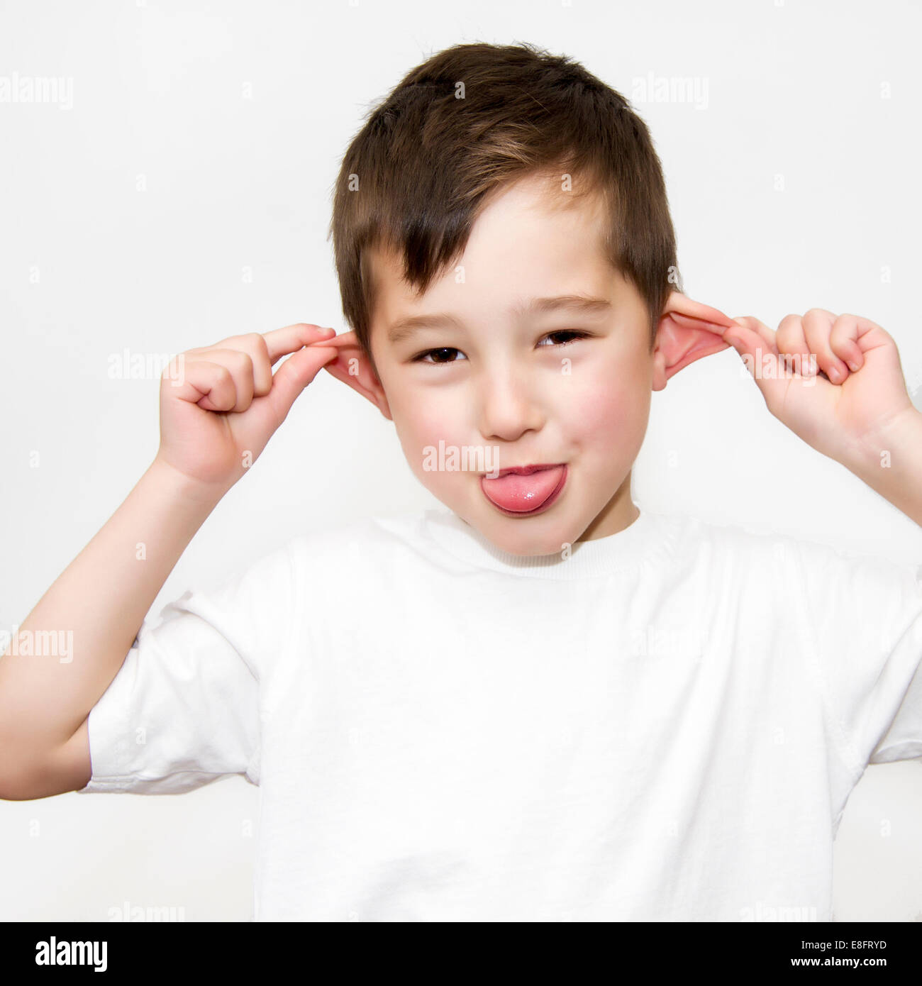 Boy pulling a funny face Stock Photo