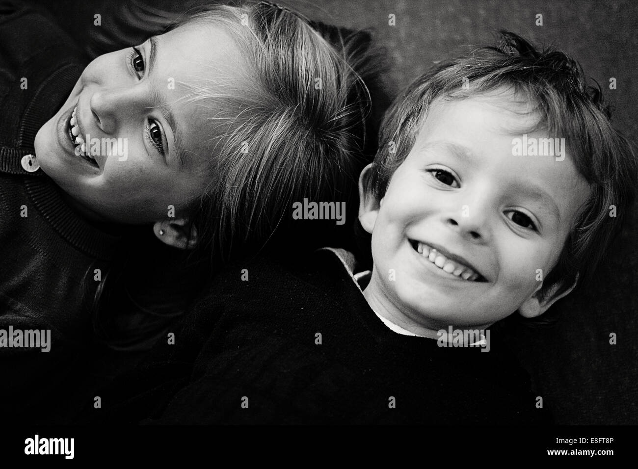 Portrait of boy and girl smiling Stock Photo