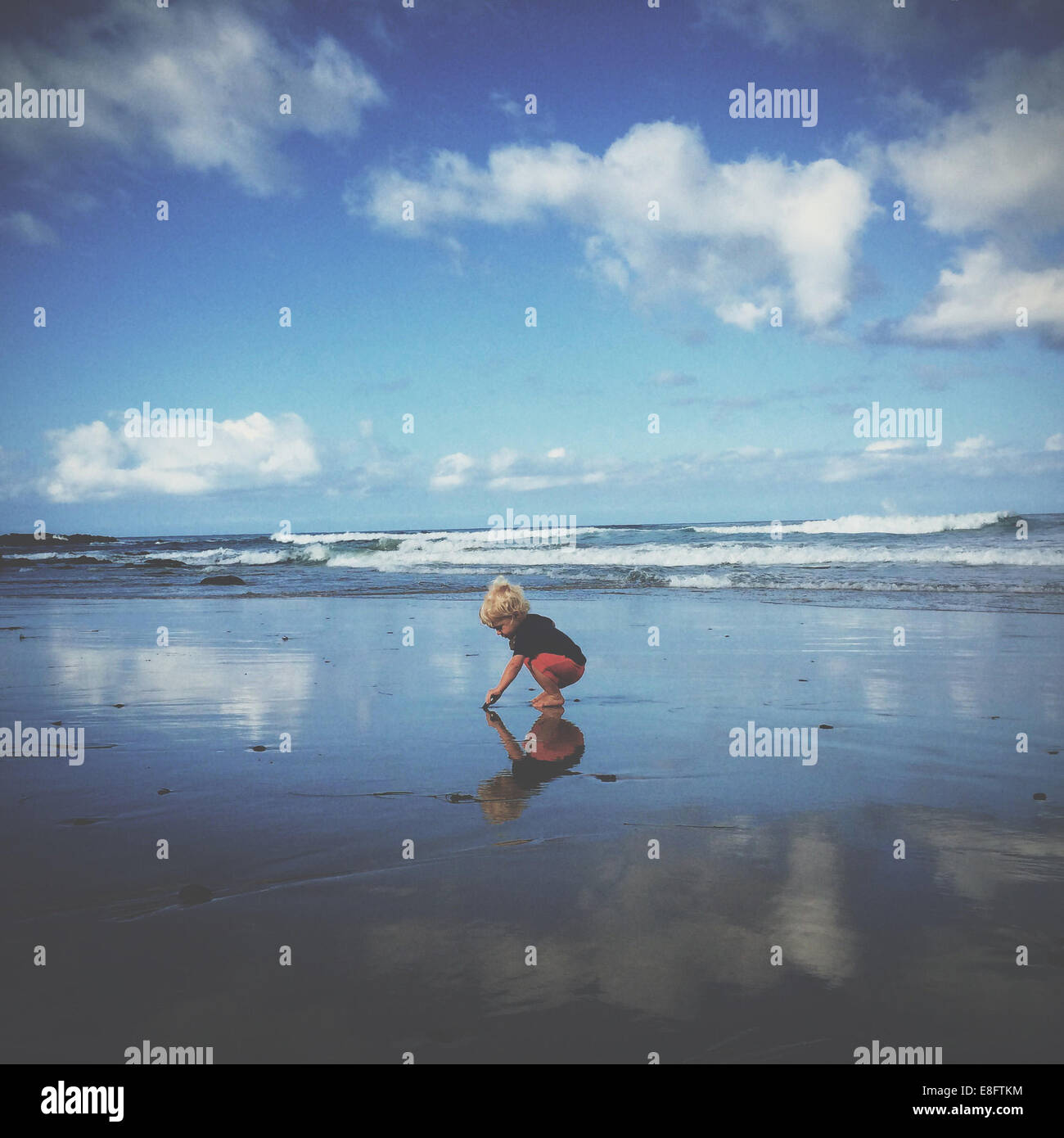 Boy playing on beach, california, america, USA Stock Photo