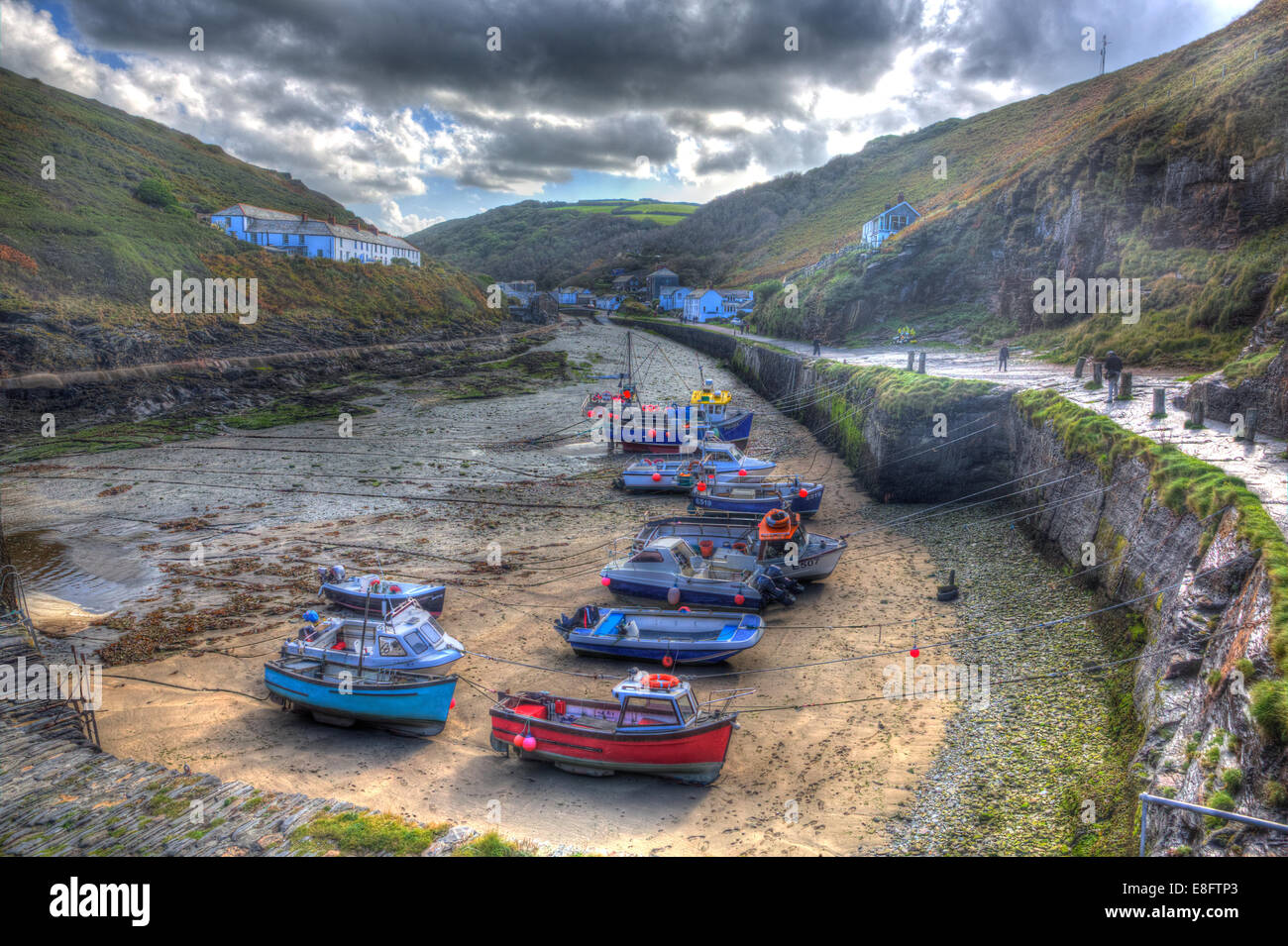 Boats in Boscastle harbour North Cornwall England UK like painting on a beautiful sunny blue sky day in HDR Stock Photo