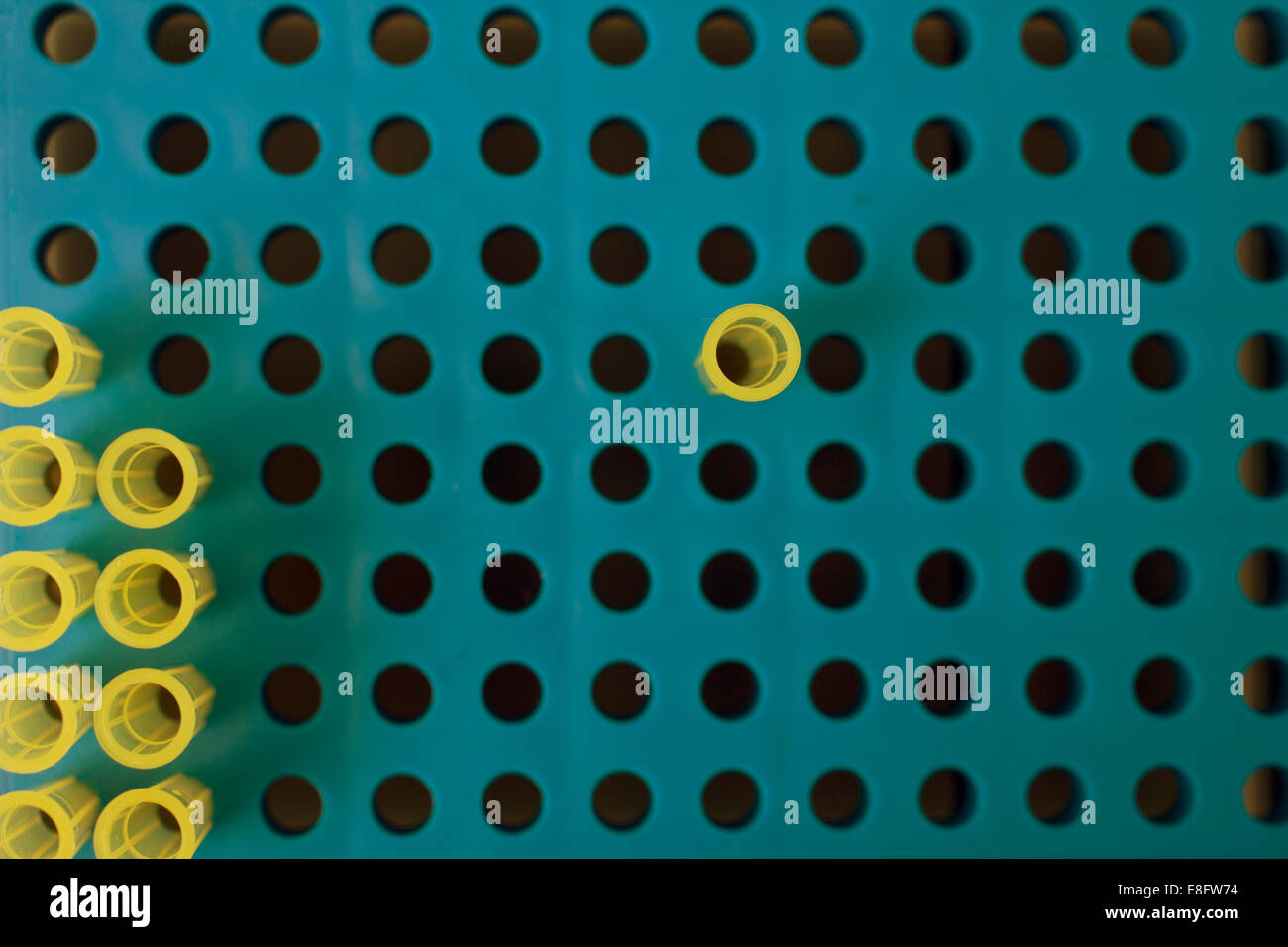 Overhead view of pipettes in Pipetting plate in laboratory Stock Photo