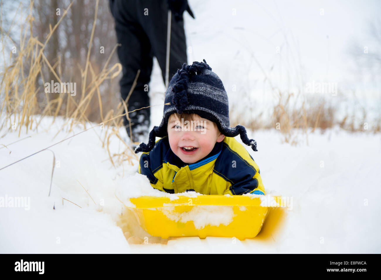 Boy on sledge (2-3 years) Stock Photo