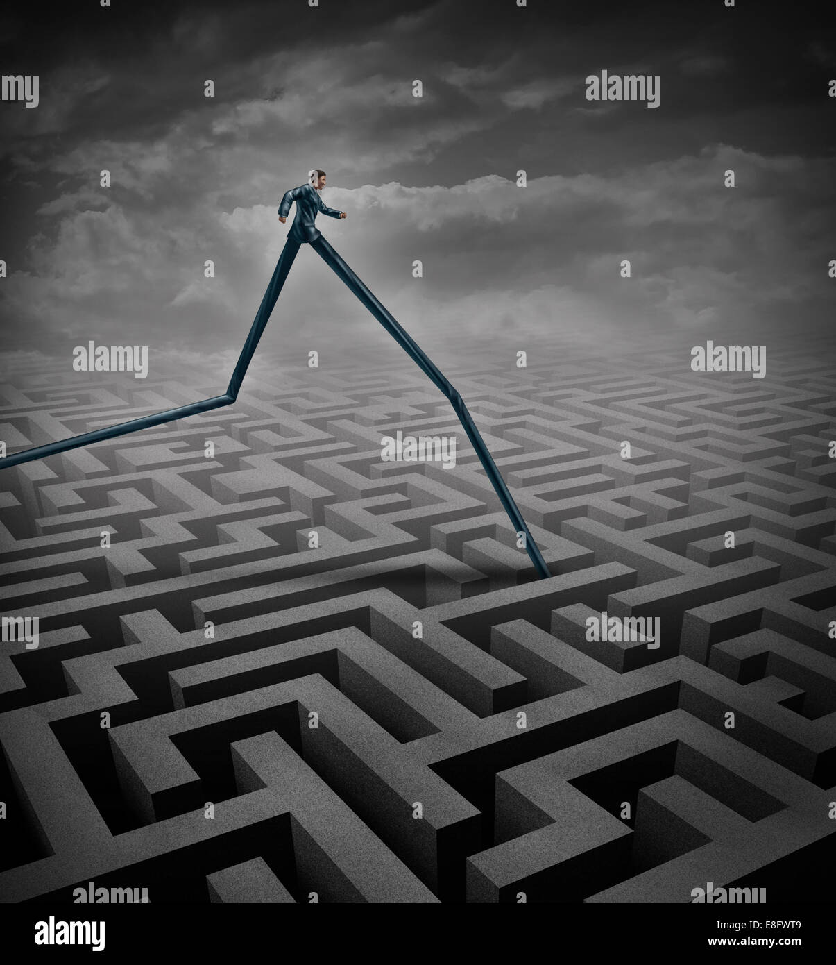 Fast track business concept as a businessperson walking over a maze or labyrinth with the advantage of long legs as a metaphor a Stock Photo