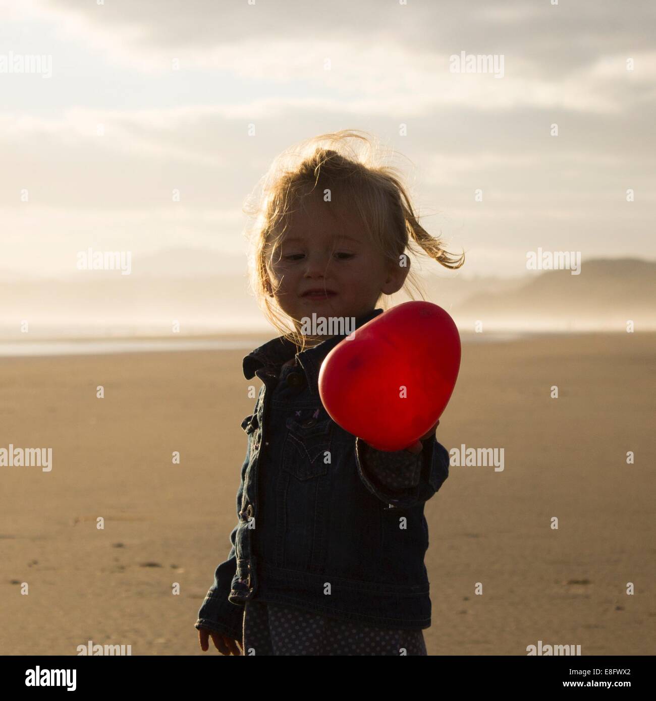 Girl (23) holding heart balloon Stock Photo Alamy