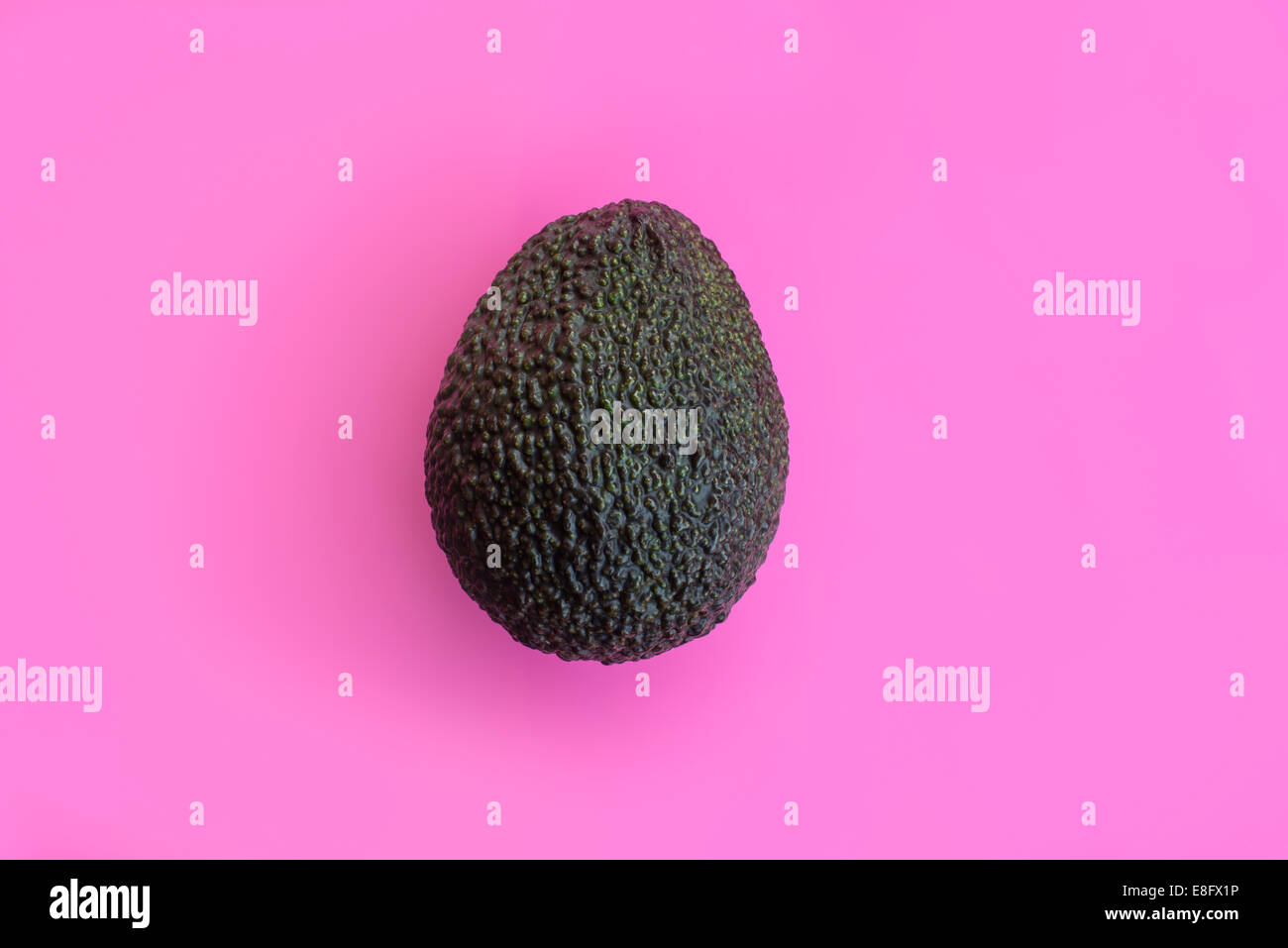 Avocado on a pink background Stock Photo
