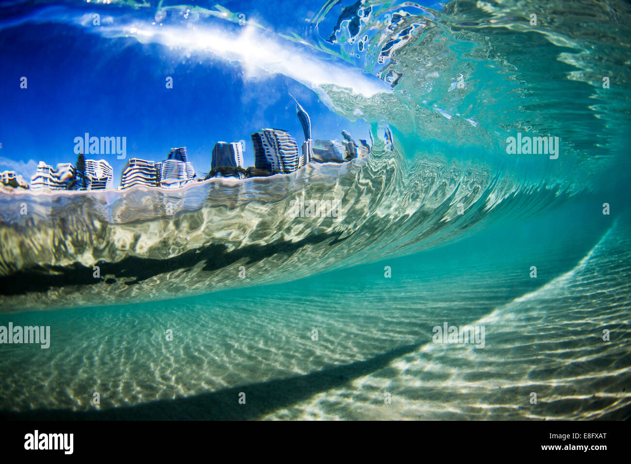 City view through wave, Gold Coast, Queensland, Australia Stock Photo