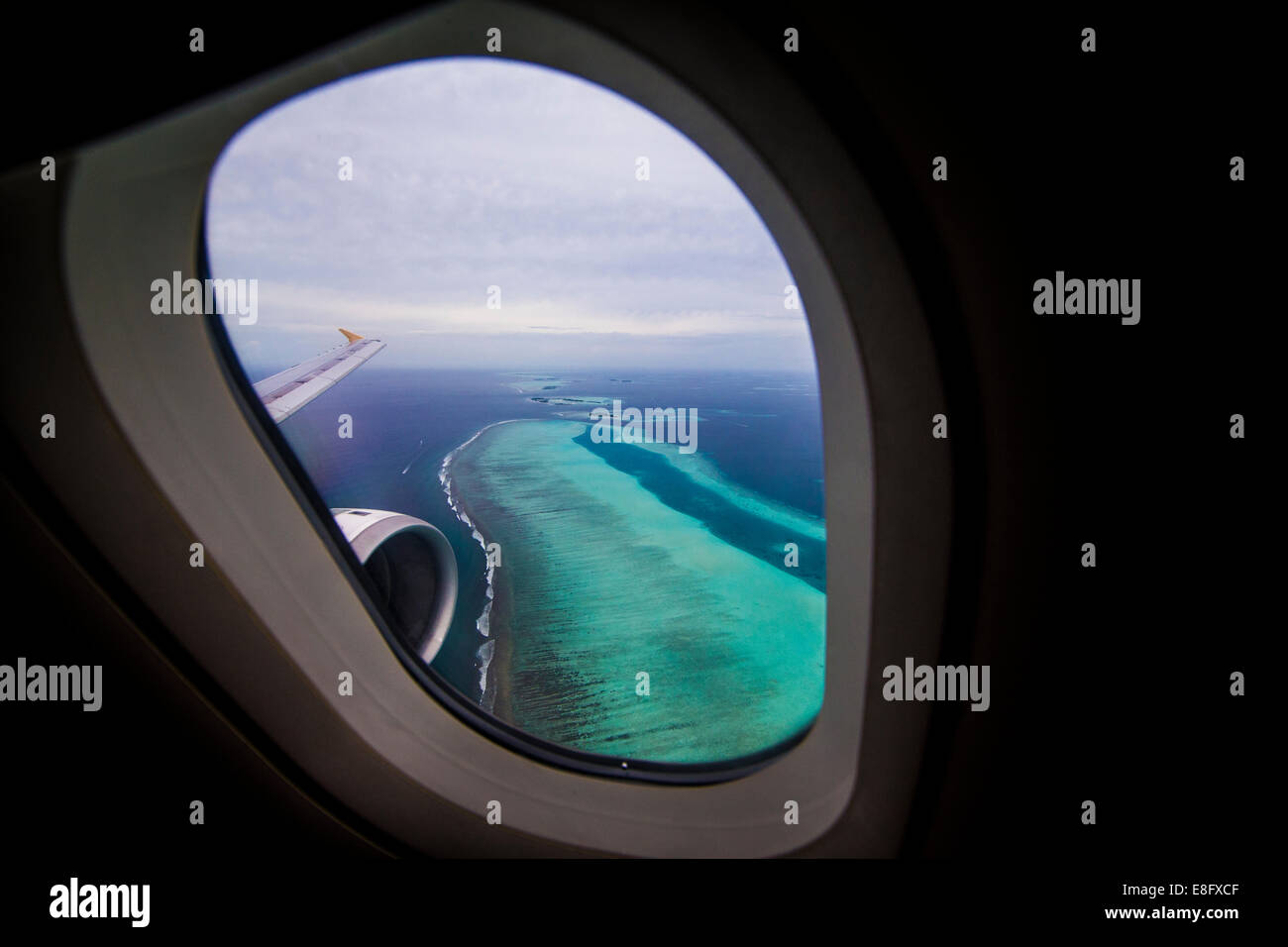 Tropical islands seen from plane window, Maldives Stock Photo