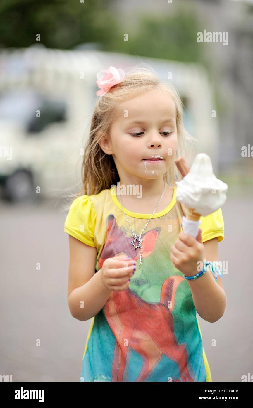 Girl (2-3) eating ice-cream Stock Photo