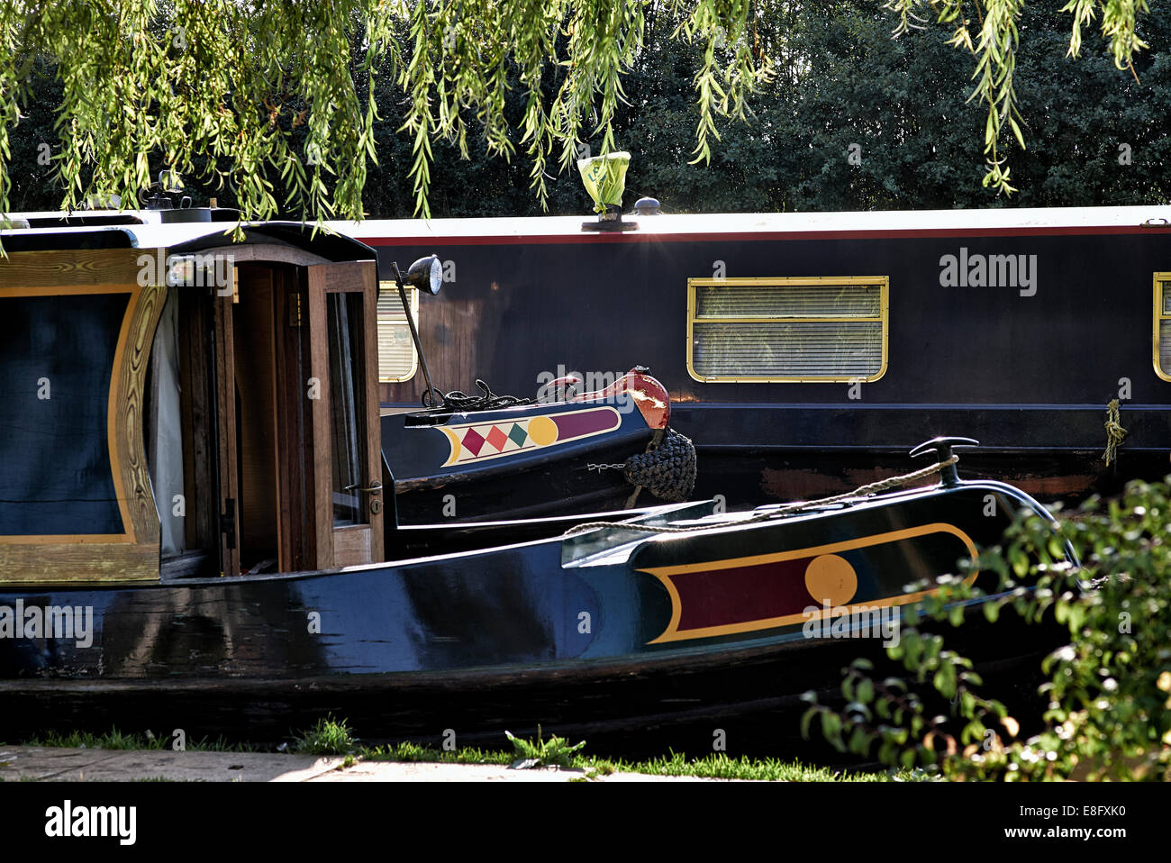 House boats. Close up section of moored canal boats. England UK Stock Photo