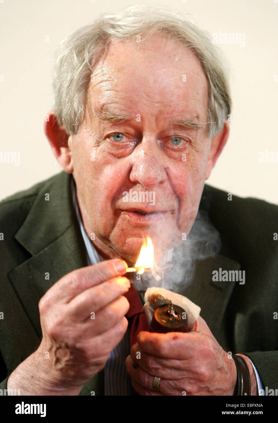 (FILE) - A file photo dated 01 June 2006 shows author Siegfried Lenz smoking his pipe during an interview in Hamburg, Germany. As informed by the publishing agency 'Hoffmann und Campe', the author of significant German post-war literature died on 07 October 2014. PHOTO: KAY NIETFELD/dpa Stock Photo