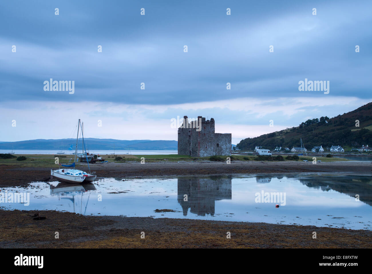 Lochranza Castle and reflections at dawn, Arran, Scotland, UK Stock Photo