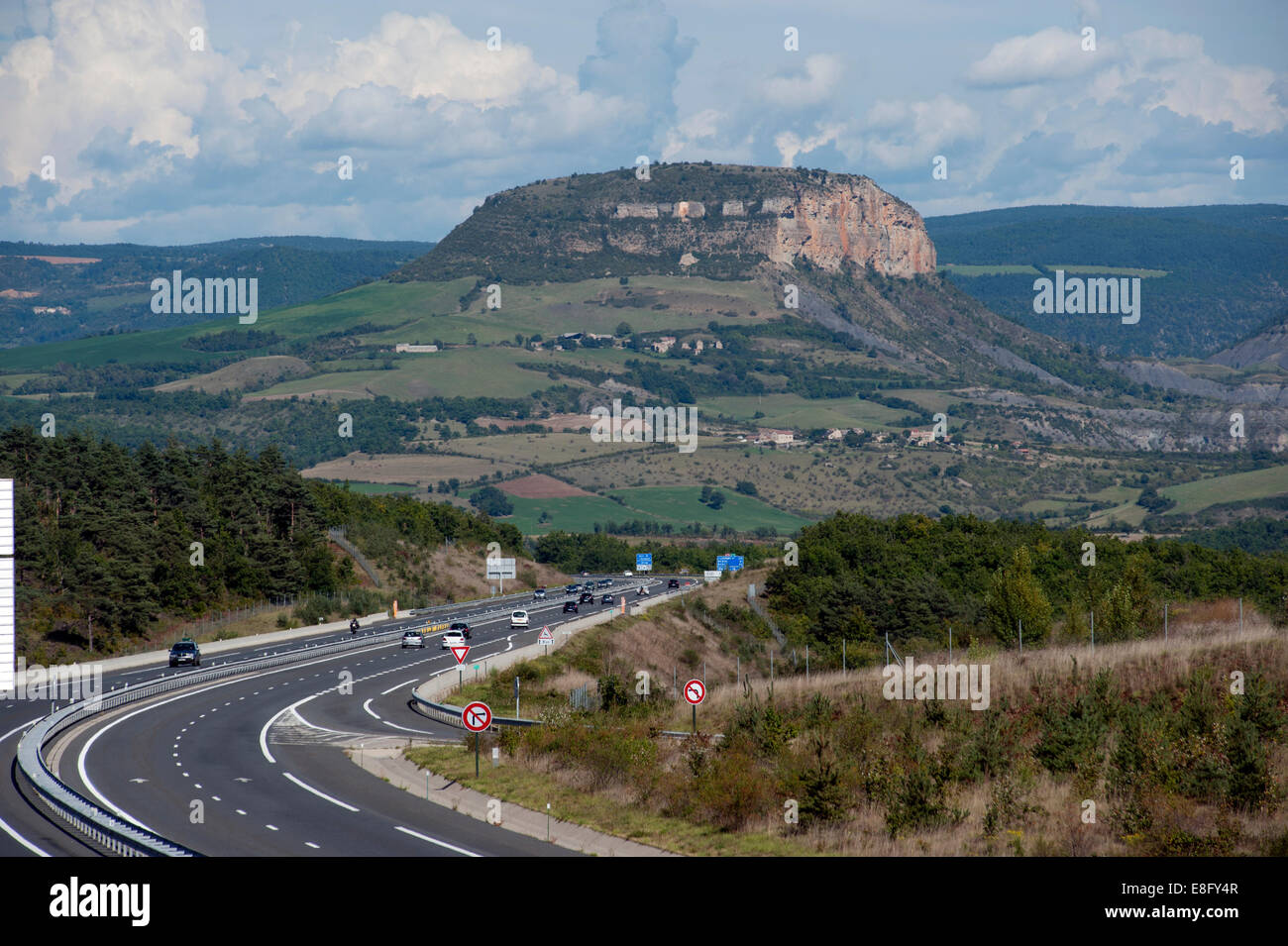 France A75 Autoroute looking north towards Volcanic Plug in Gorges du Tarn area, north of Millau. September 2014 Stock Photo