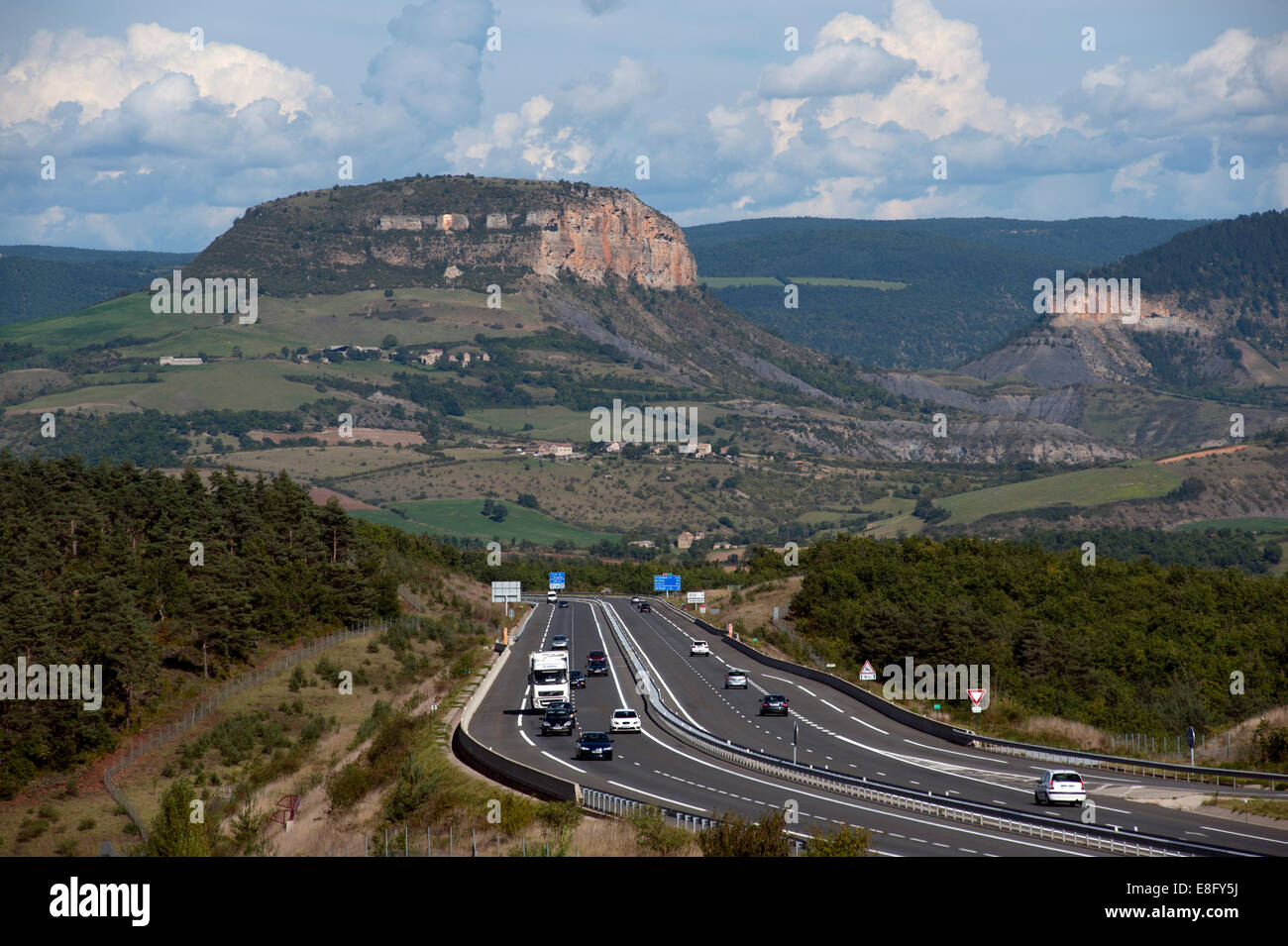 France A75 Autoroute looking north towards Volcanic Plug in Gorges du Tarn area, north of Millau. September 2014 Stock Photo