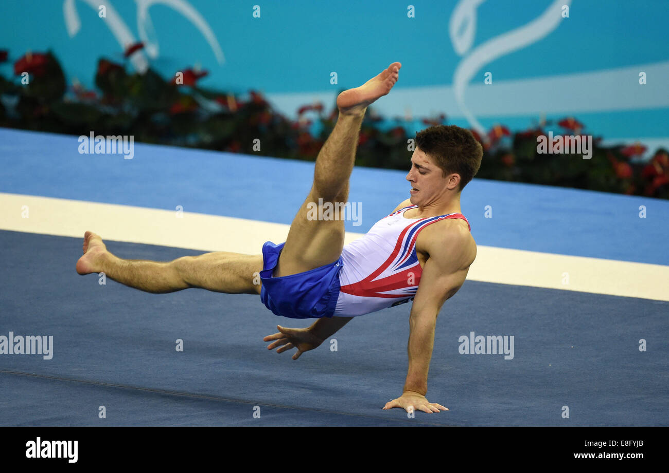Nanning, China's Guangxi Zhuang Autonomous Region. 7th Oct, 2014. Max Whitlock of the Great Britian performs on the floor during the men's team finals of the 45th Gymnastics World Championships in Nanning, capital of south China's Guangxi Zhuang Autonomous Region, Oct. 7, 2014. Stock Photo